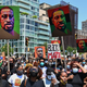 Protestors hold pictures of George Floyd as they march during a Juneteenth rally at Grand Army Plaza on June 19, 2020 in the Brooklyn Borough of New York City.
